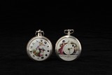 A PAIR OF VINTAGE SILVER POCKET WATCHES