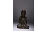 A PARCEL-GILT BRONZE FIGURE OF SEATED GUANYIN