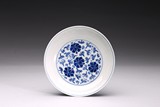 A BLUE AND WHITE 'FLORAL SCROLL' DISH 