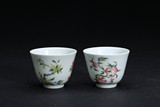 A PAIR OF FAMILLE ROSE 'SANDUO' CUPS