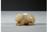A CARVED YELLOW JADE BEAR 