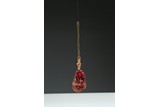 A RED AMBER 'DOUBLE GOURD' PENDANT
