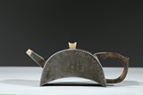 A PEWTER 'INSCRIBED' CRESCENT SHAPED TEAPOT 