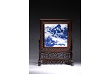 A BLUE AND WHITE PANEL MOUNTED TABLE SCREEN