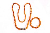 A GROUP OF TWO AMBER DZI NECKLACE AND BRACELET