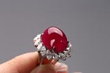 A CABOCHON RUBY AND DIAMOND RING
