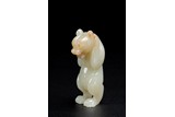 A CHINESE WHITE JADE CARVING OF STANDING BEAR