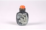 A BLACK AND WHITE JADE 'SCHOLAR' SNUFF BOTTLE