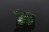 A CHINESE GREEN JADE 'BEAST' PAPERWEIGHT