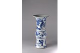 A CHINESE BLUE AND WHITE 'FIGURINES' GU VASE