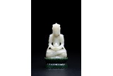 A CHINESE WHITE JADE CARVING OF SEATED AMITABHA