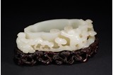 A CHINESE WHITE JADE 'BOYS AND LINGZHI' WASHER