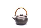 AN INCISED BLACK YIXING TEAPOT AND COVER