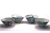 A GROUP OF FOUR BLUE AND WHITE BOWLS