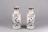 A PAIR OF FAMILLE ROSE 'FIGURINES' VASES 