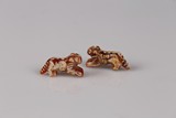 A PAIR OF ARCHAIC CARNELIAN AGATE TIGER SHAPED BEADS