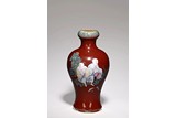 A FAMILLE ROSE 'LUOHAN' RED GLAZE VASE